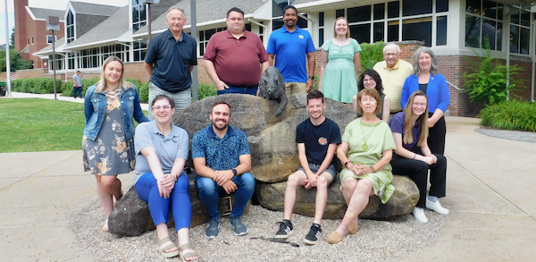 PGAA Board of Directors posed with Bruiser Bobcat statue