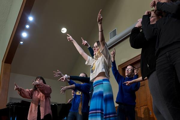 PItt-Greensburg Chorale enjoys a light-hearted rehearsal.