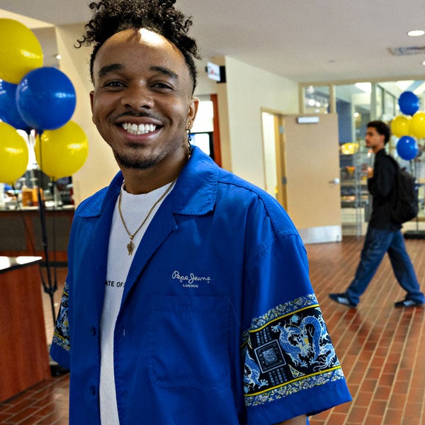A Greensburg student smiles while attending a campus event.