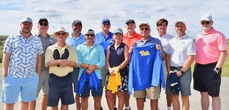 Large group of golfers smiling for photo.