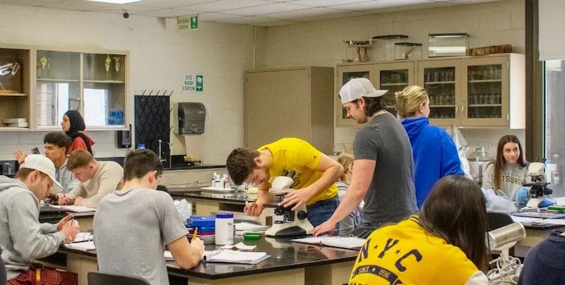 Laboratory classroom including several SLICE students working