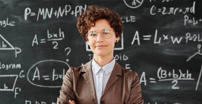 professor in front of a chalkboard