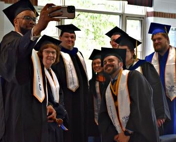 Pitt Greensburg graduates celebrate at commencement.