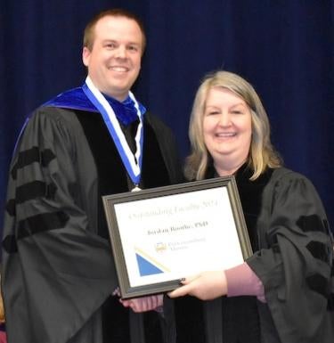 Dr. Jordan Boothe receiving award